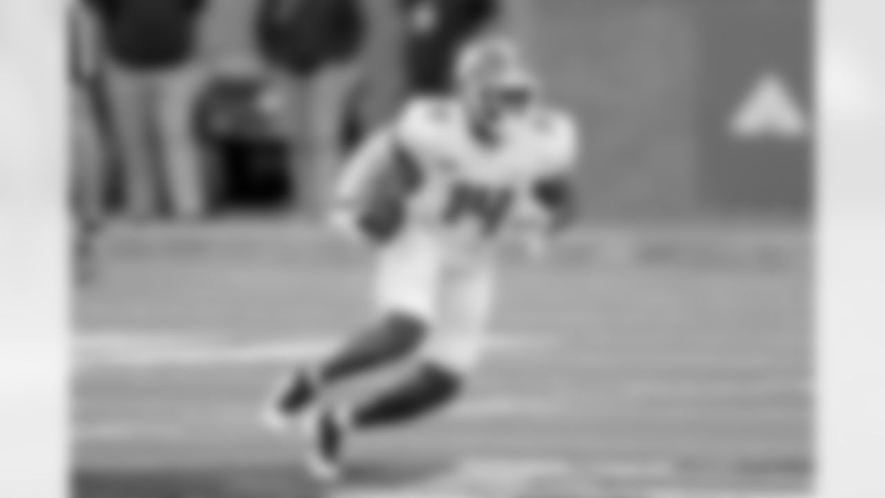 American Team wide receiver Cornell Powell of Clemson (14) runs the ball during the second half of the NCAA college football Senior Bowl in Mobile, Ala, Saturday, Jan. 30, 2021. (AP Photo/Rusty Costanza)