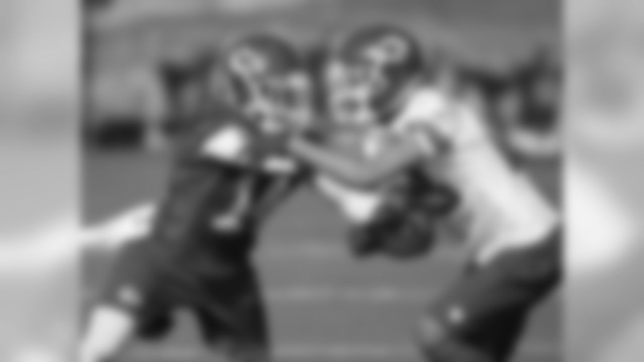 WR Darryl Surgent and CB Phillip Gaines fight for position.