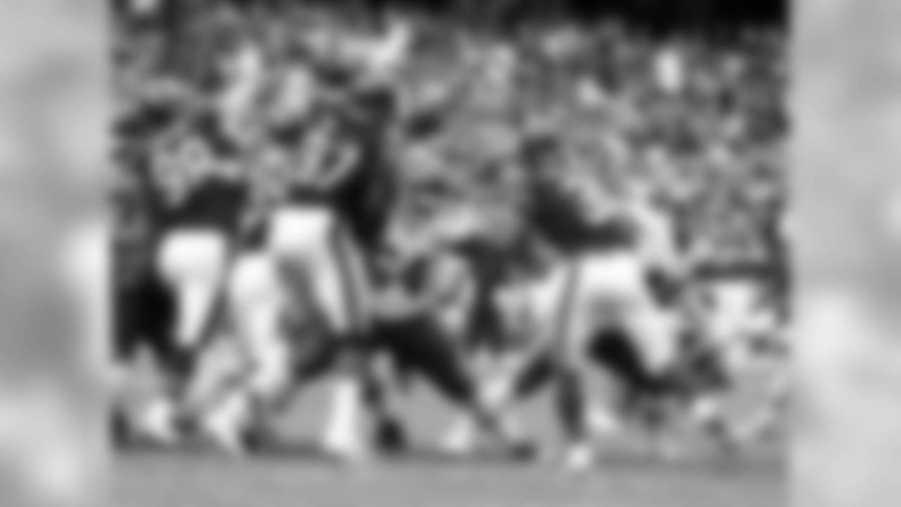Kansas City Chiefs offensive lineman Daniel Munyer (64) blocks Chicago Bears linebacker Willie Young (97) during the first half of the preseason game, Saturday, August 27, 2016, in Chicago, Illinois.
