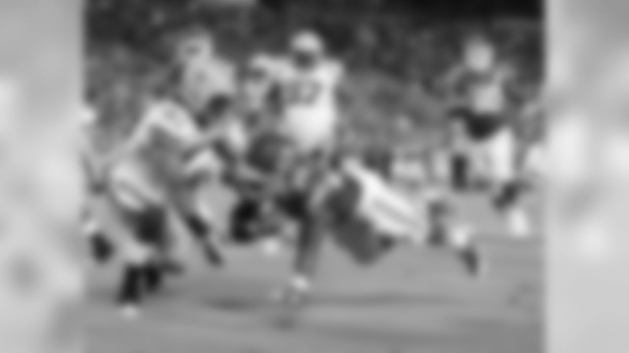 Offensive Kansas City Chiefs player 32 dives forward with the football during the 08-29-13 preseason game vs. Green Bay.