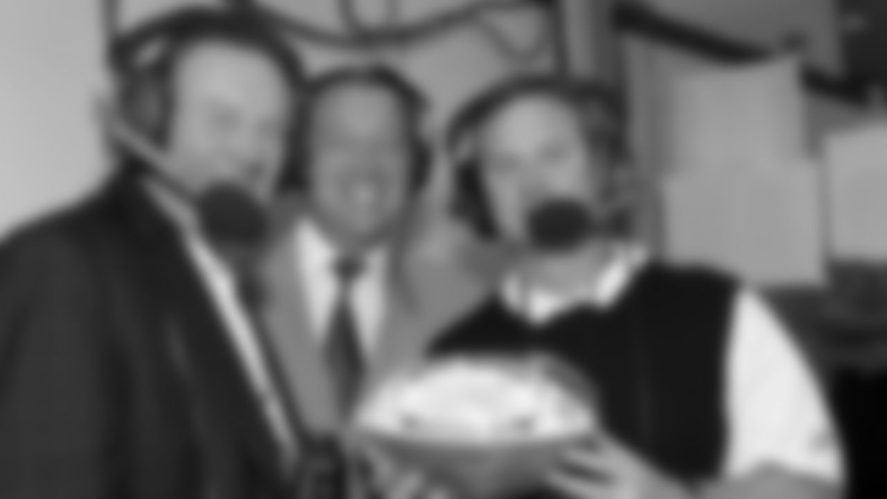 Len Dawson, Kansas City Chiefs general manager Carl Peterson and Mitch Holthus pose for a group photo honoring Mitch as the most prolific play by play announcer in Chiefs history during the Sept. 21 2003 away game against the Houston Texans.