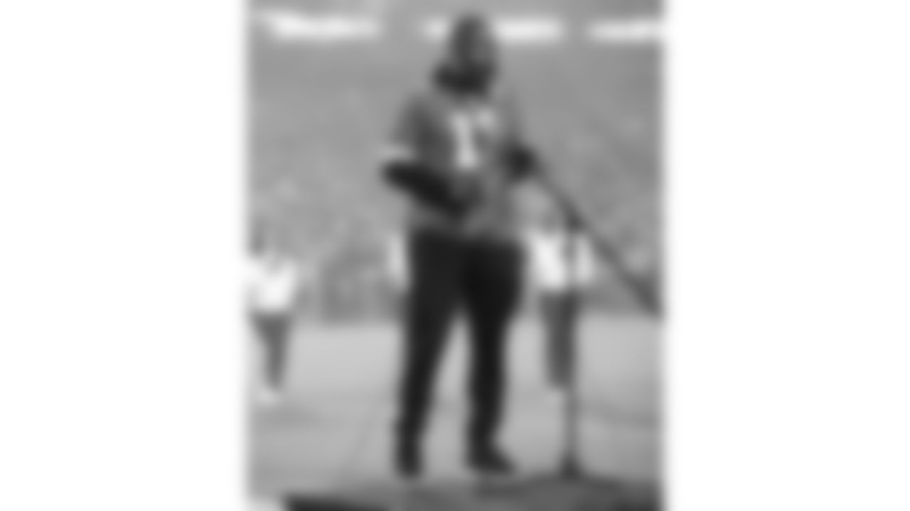 Mike Phillips plays the saxophone for the National Anthem prior to an NFL football game against the New York Giants, Monday, November 1, 2021 in Kansas City.