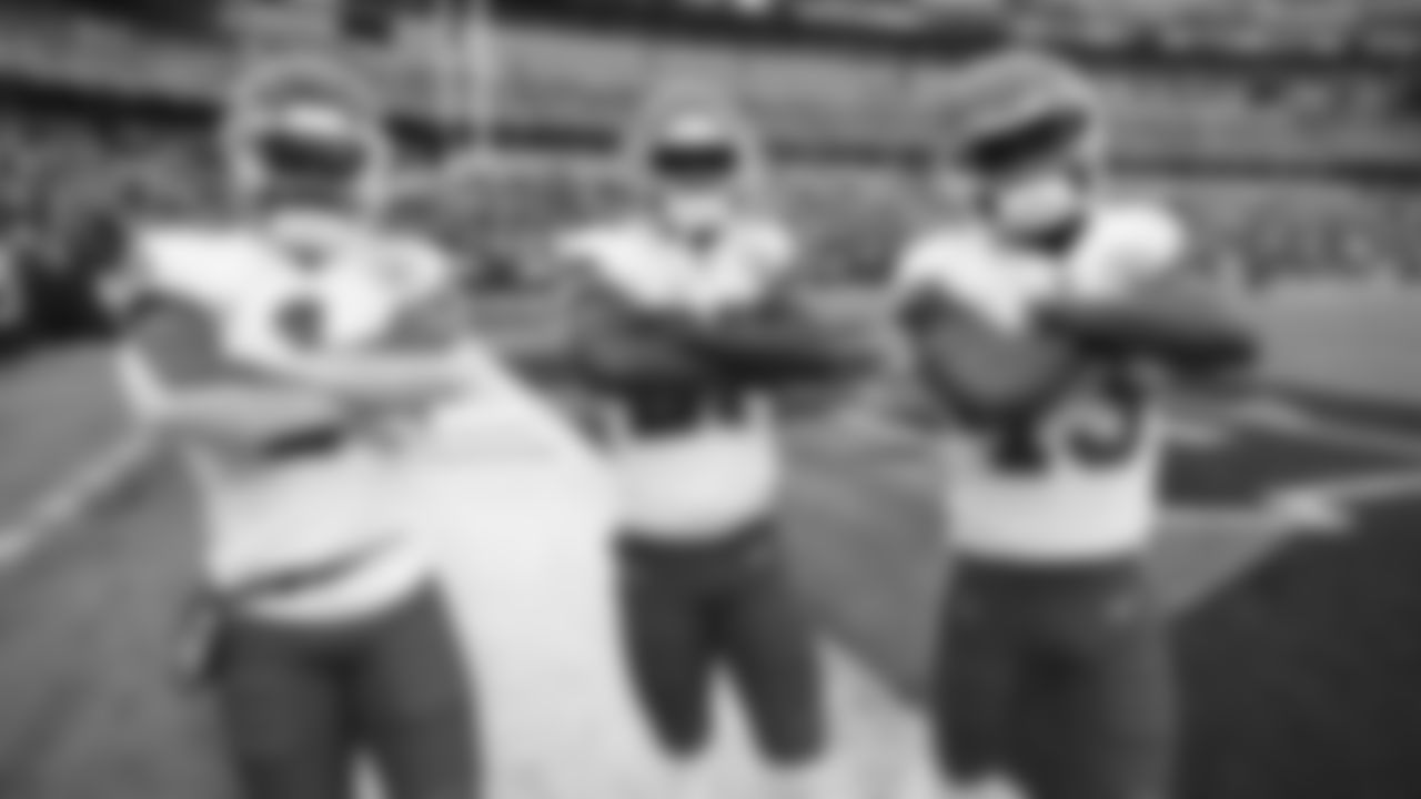 Kansas City Chiefs running back Jerick McKinnon (1), defensive back Rashad Fenton (27), and wide receiver Byron Pringle (13) prior to an NFL football game against the Cincinnati Bengals, Sunday, January 2, 2022 in Cincinnati.