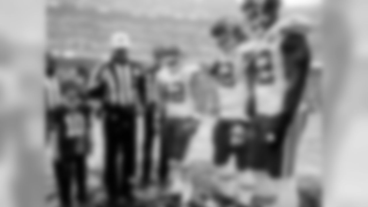 Team captains at the coin toss.