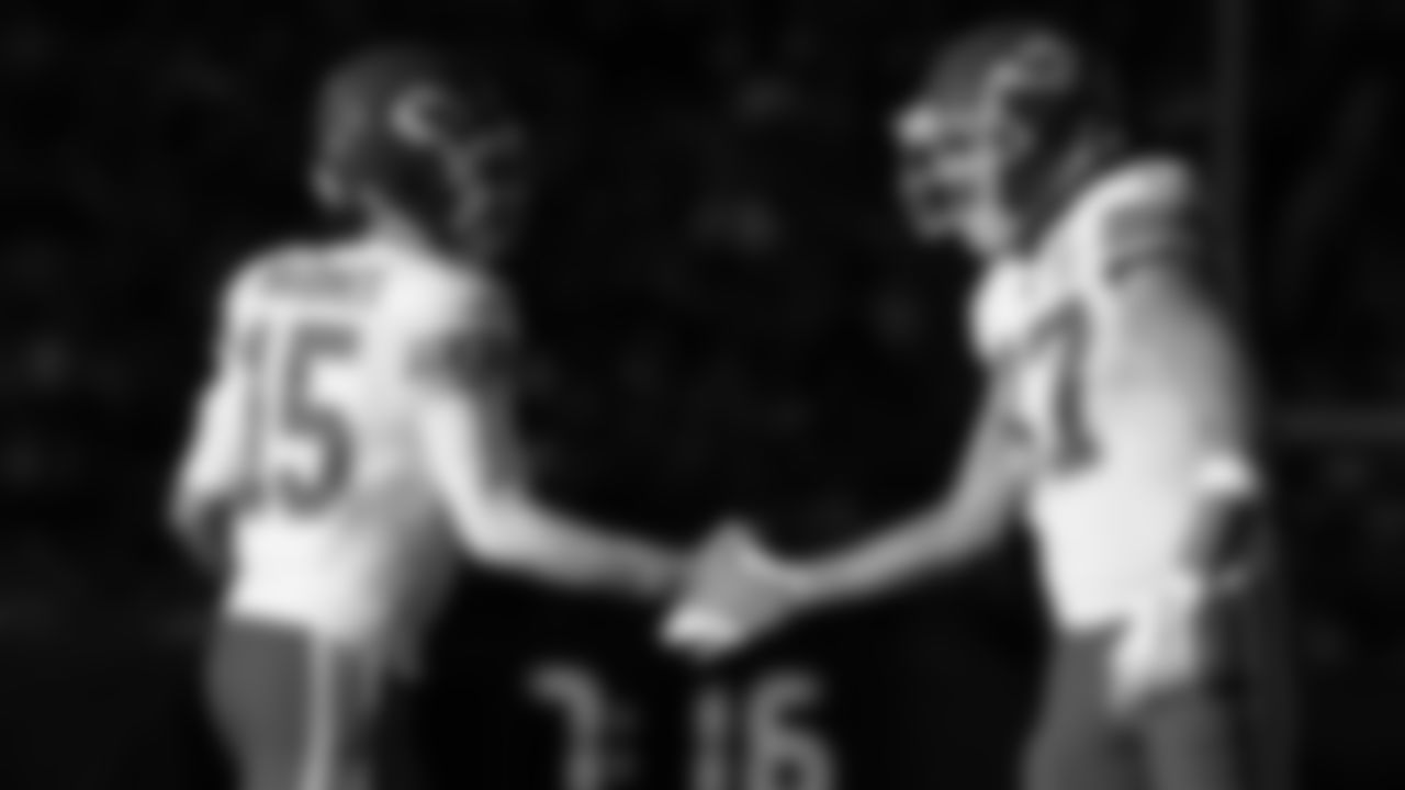 Kansas City Chiefs quarterback Patrick Mahomes (15) high-fives tight end Travis Kelce (87) during an NFL football game against the Denver Broncos, Sunday, December 11, 2022 in Denver.