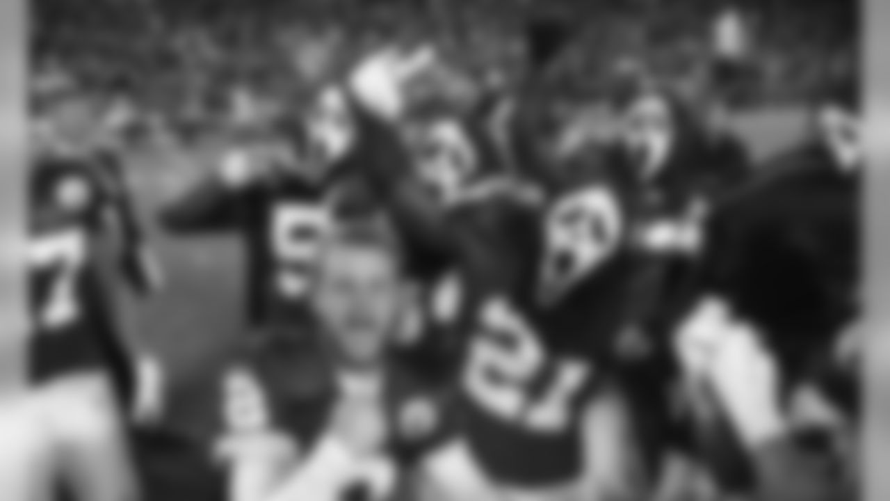 Kansas City Chiefs punter Dustin Colquitt (2) celebrates with teammates after the game.
