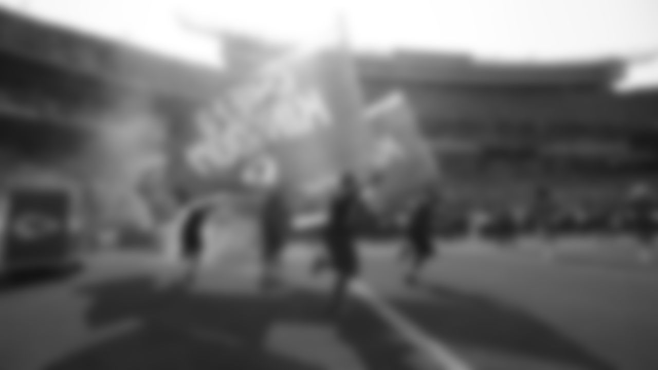 Kansas City Chiefs flag runners prior to an NFL football game against the Los Angeles Chargers, Sunday, September 26, 2021 in Kansas City.
