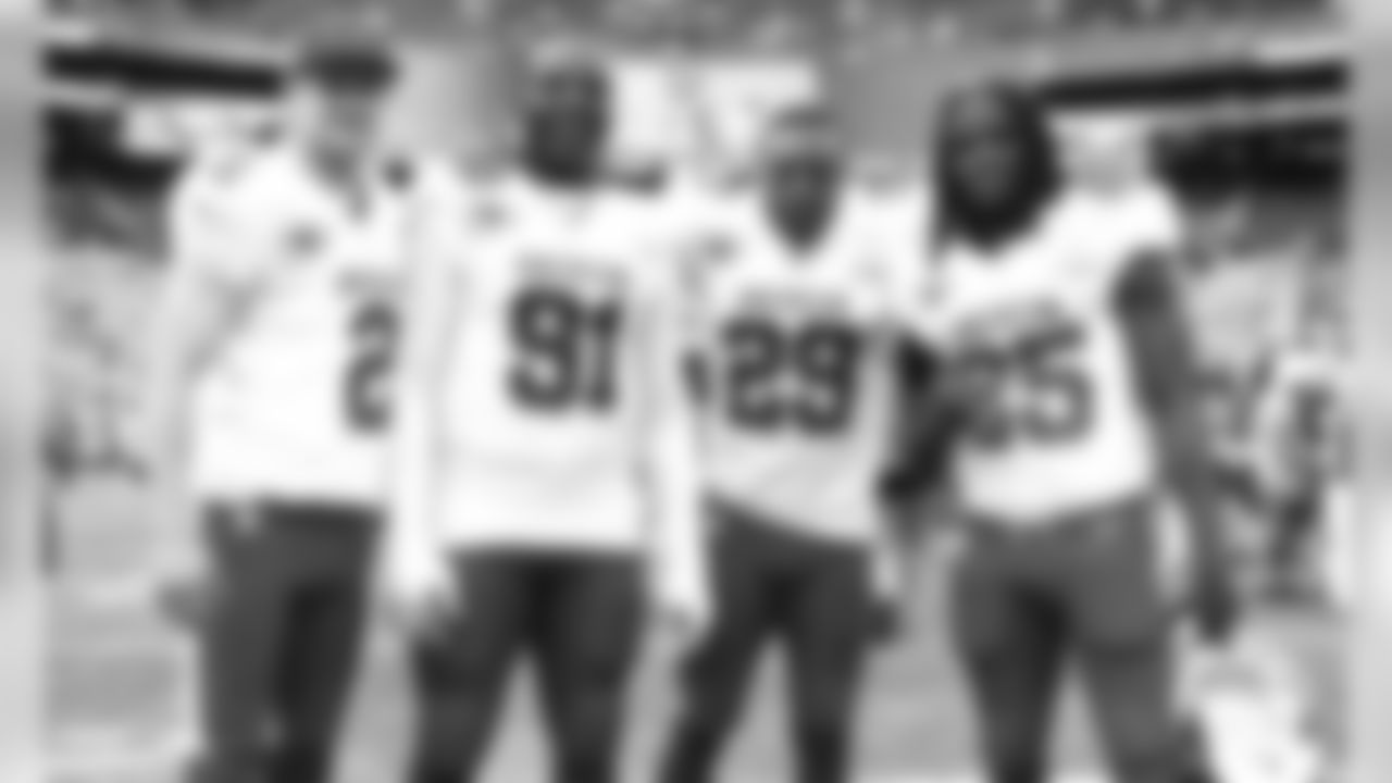 Kansas City Chiefs Pro Bowlers pose together on the field after the game.