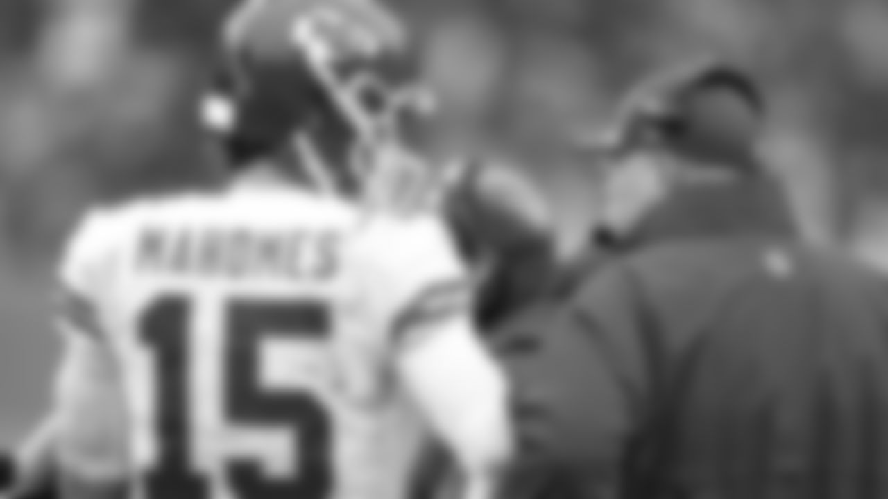 Kansas City Chiefs quarterback Patrick Mahomes (15) talks to Head Coach Andy Reid on the sideline during an NFL football game against the Denver Broncos on Saturday, January 8, 2021 in Denver.