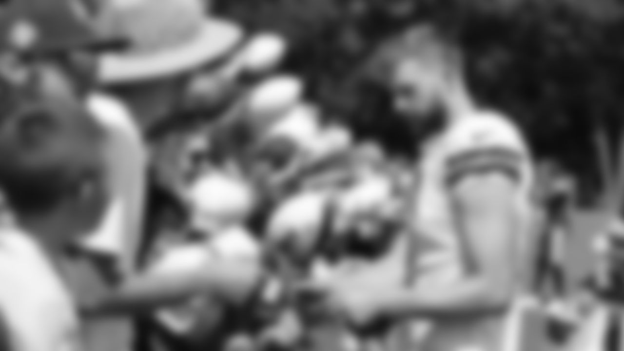 Kansas City Chiefs kicker Harrison Butker (7) signs autographs after training camp at Missouri Western State University.
