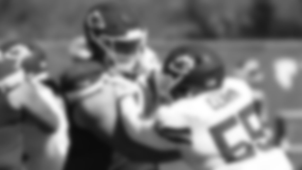 Kansas City Chiefs offensive guard Andrew Wylie (77) and defensive end Frank Clark (55) during practice at the The University of Kansas Health System Training Complex.
