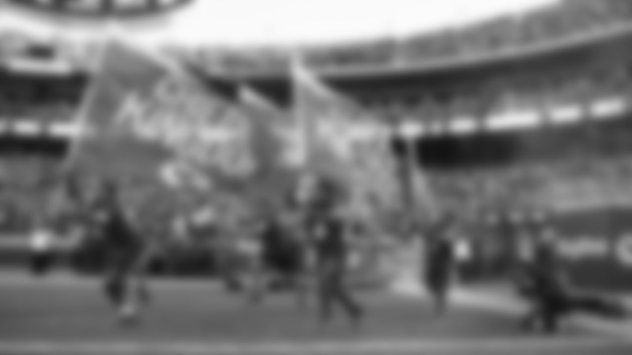 Kansas City Chiefs flag runners prior to an NFL football game against the Green Bay Packers, Sunday, November 7, 2021 in Kansas City.