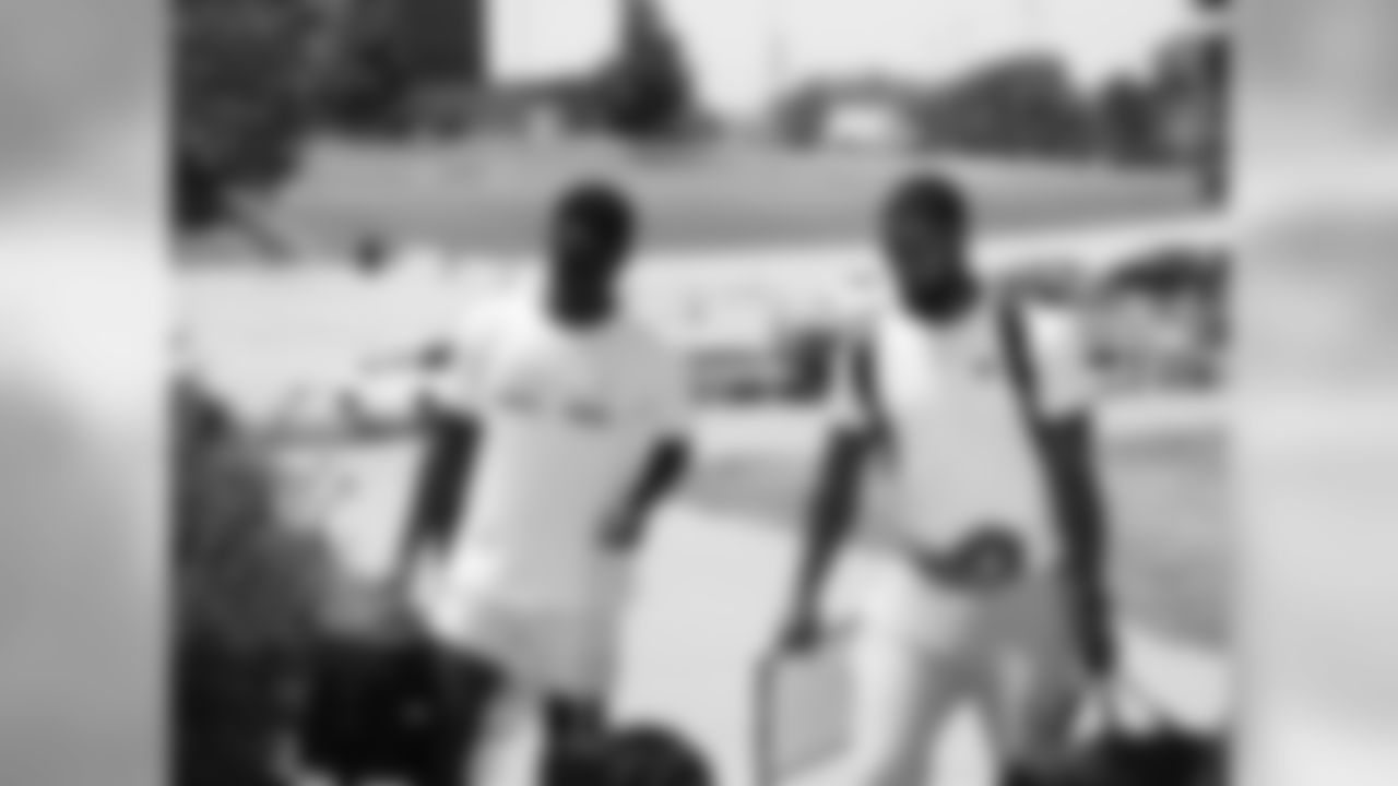 Players and Coaches arrive at training camp