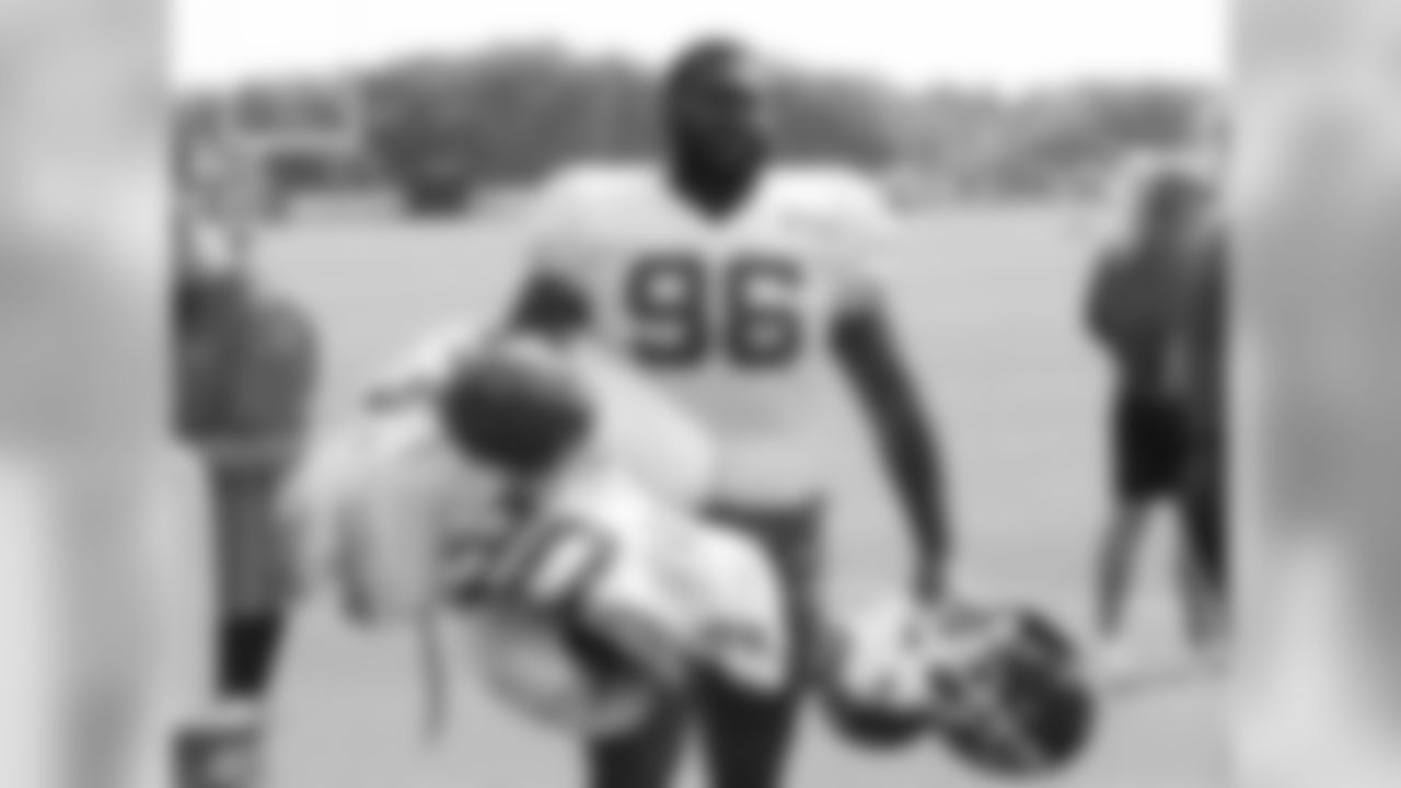 Kansas City Chiefs defensive tackle Dee Liner (96) carries others helmets and pads after practice 8/4/18 at Chiefs Training Camp at Missouri Western State University in St Joseph, Missouri