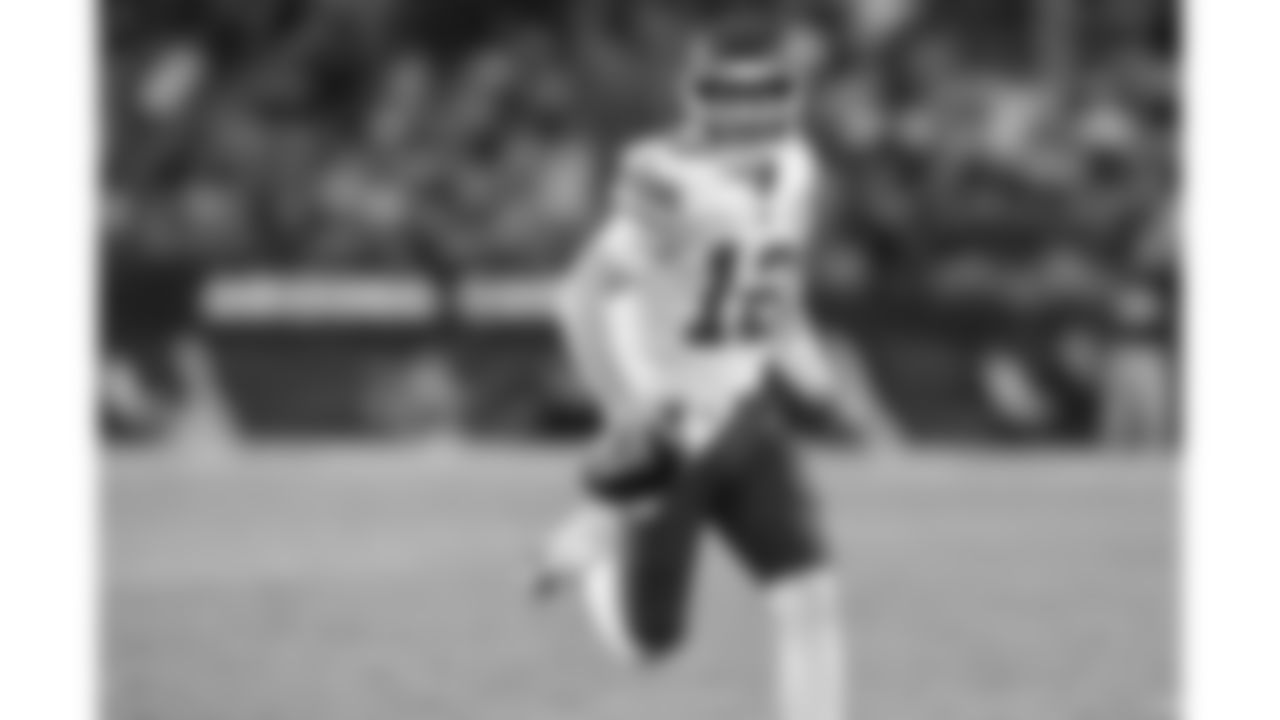 Kansas City Chiefs quarterback Shane Buechele (12) completes a 15-yard touchdown run during the Preseason Week 2 NFL football game on Saturday, August 19, 2023 in Glendale, AZ.