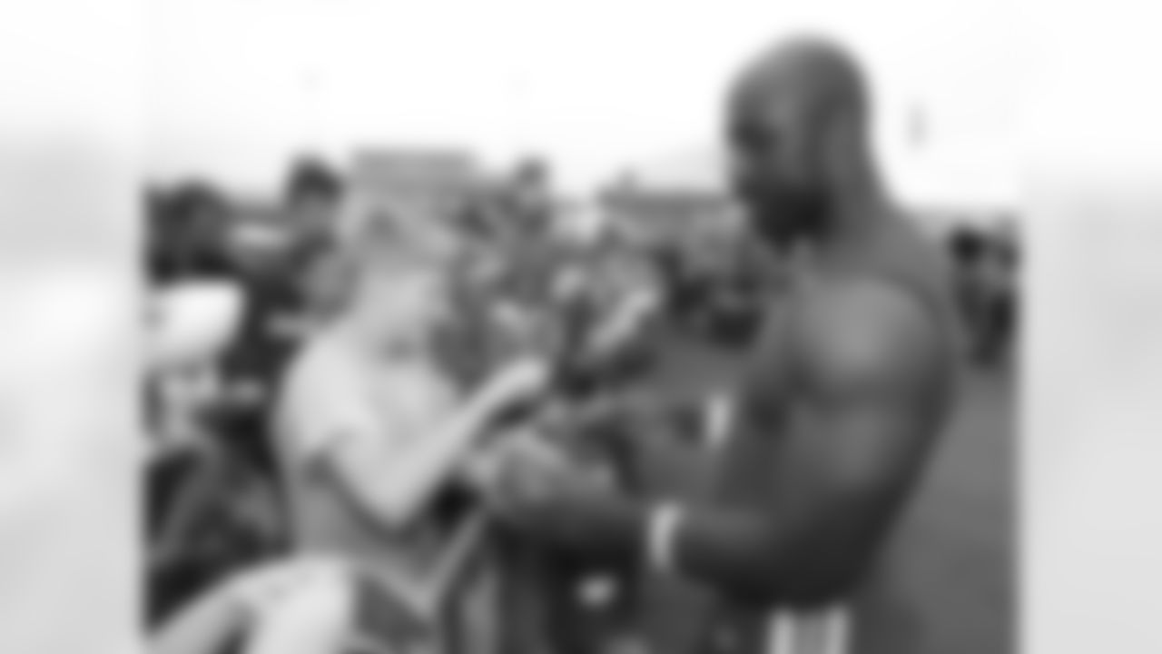Kansas City Chiefs linebacker Justin Houston (50) PLAYER signs autographs after practice 7/29/18 at Chiefs Training Camp at Missouri Western State University in St Joseph, Missouri