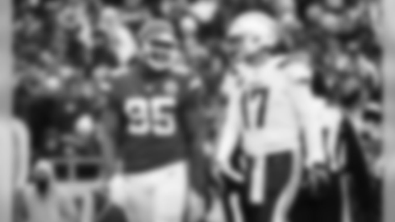 Kansas City Chiefs Defensive Tackle Chris Jones (95) and Los Angeles Chargers Quarterback Philip Rivers (17) during the game between the Kansas City Chiefs and the Los Angeles Chargers at Arrowhead Stadium.