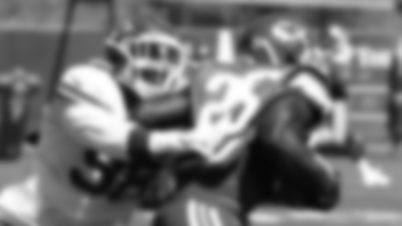 Kansas City Chiefs defensive end Tershawn Wharton (98) stops running back Derrick Gore (40) during practice at the The University of Kansas Health System Training Complex.