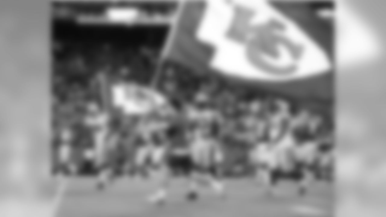 Chiefs flags are paraded across the field after a touchdown during the 08-29-13 preseason game vs. Green Bay.