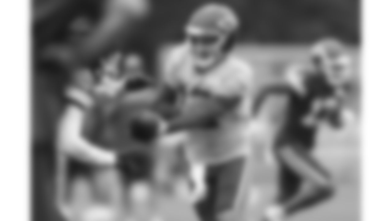 Kansas City Chiefs quarterback Shane Buechele (12) hands off the ball at Kansas City Chiefs Training Camp in St. Joseph, MO on Thursday, August 3, 2023.