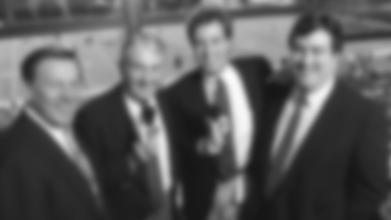 The 101 KCFX broadcast team poses for a group photo in the press box at Arrowhead Stadium in 1991.