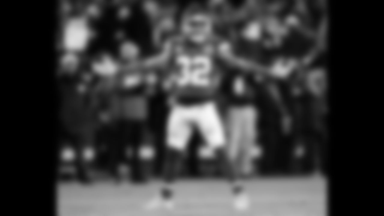 Kansas City Chiefs free safety Tyrann Mathieu (32) celebrating with his arms wide during the wildcard playoff football game against the Pittsburgh Steelers, Sunday, January 16, 2022 in Kansas City.