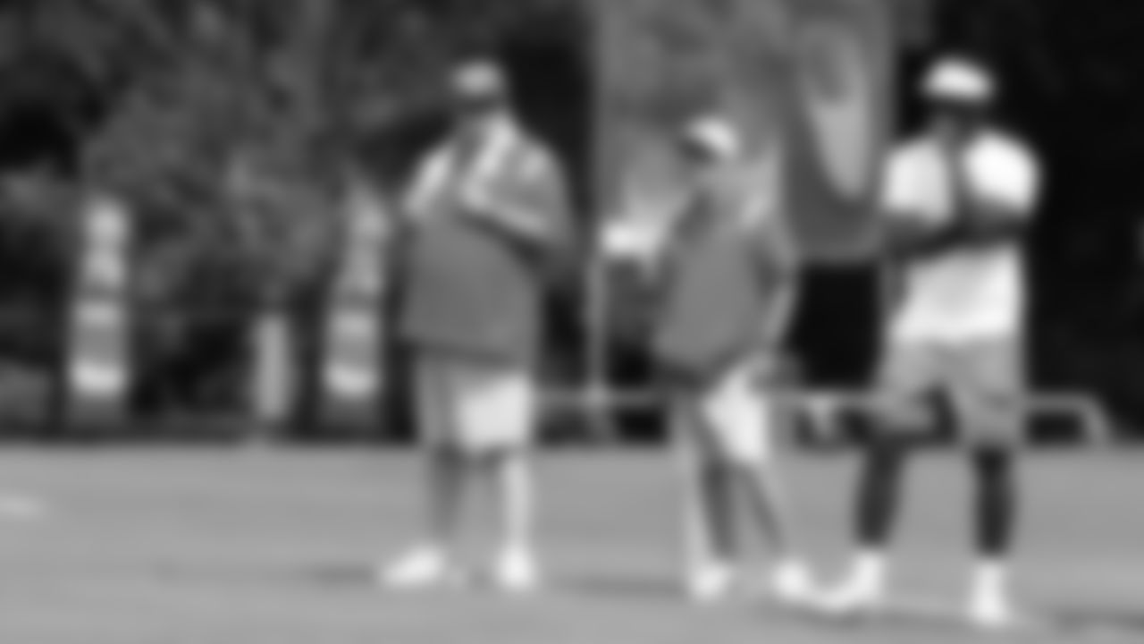 Eric Stonestreet, Kansas City Chiefs Assistant Equipment Manager Chris Shropshire, and Michael Vick during training camp at Missouri Western State University.