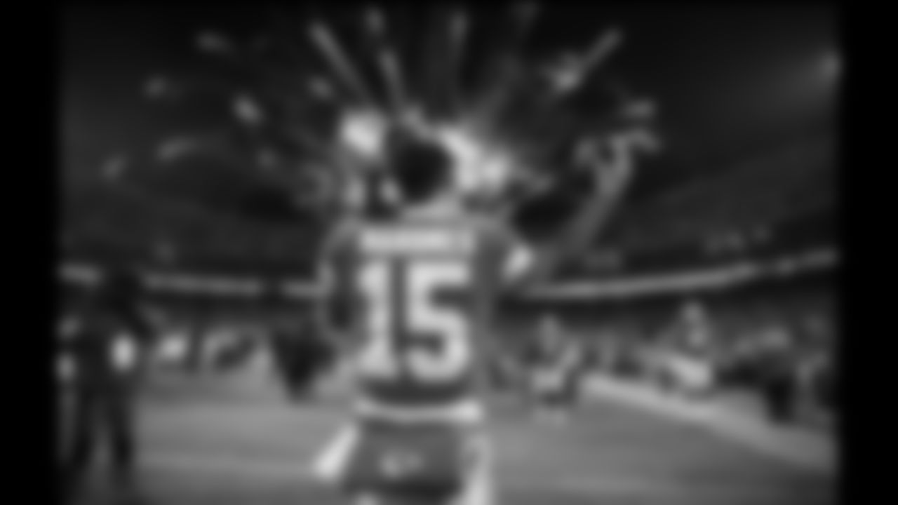 Kansas City Chiefs quarterback Patrick Mahomes (15) warming up with fireworks in the sky prior to the wildcard playoff football game against the Pittsburgh Steelers, Sunday, January 16, 2022 in Kansas City.