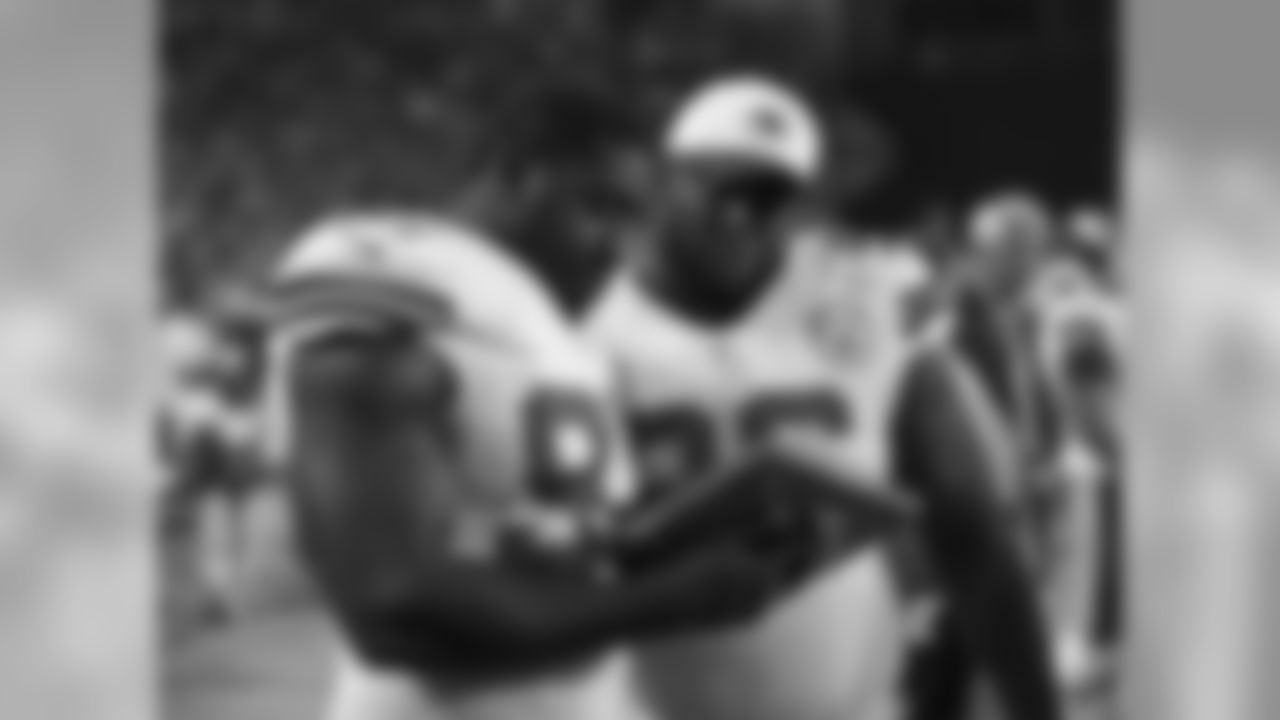 Kansas City Chiefs defensive lineman Allen Bailey (97) and Kansas City Chiefs defensive lineman Jaye Howard (96) go over plays on the sideline.