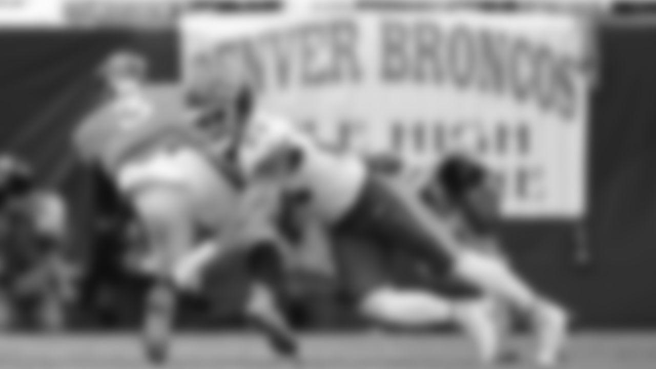 Kansas City Chiefs middle linebacker Drue Tranquill (23) makes a tackle during the NFL Week 8 matchup against the Denver Broncos at Empower Field at Mile High in Denver, Colorado on October 29, 2023.