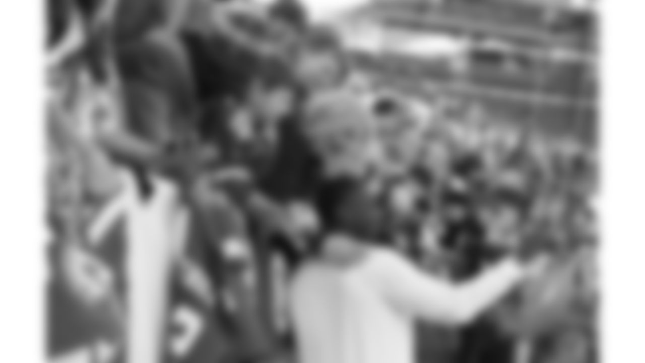Kansas City Chiefs cornerback Joshua Williams (23) takes selfies with fans prior to an NFL football game against the Denver Broncos, Sunday, December 11, 2022 in Denver.