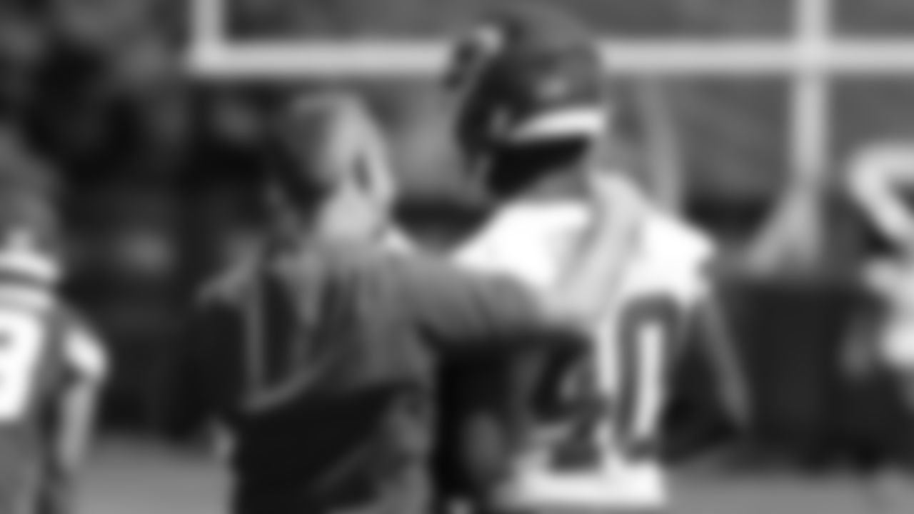 Defensive Coordinator Steve Spagnuolo and defensive back Nasir Greer (40) during the first day of practice for Kansas City Chiefs rookie mini camp.