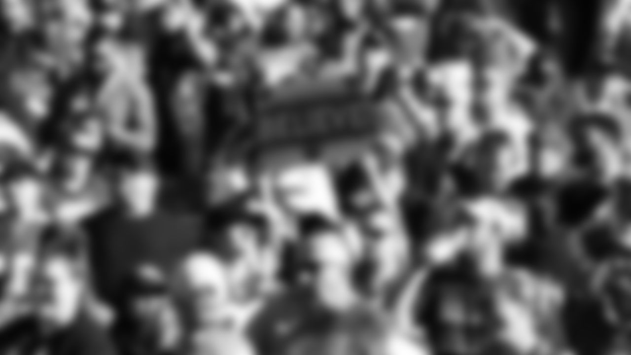 A Kansas City Chiefs fan holds a "Believe" sign prior to an NFL football game against the Denver Broncos, Sunday, December 11, 2022 in Denver.