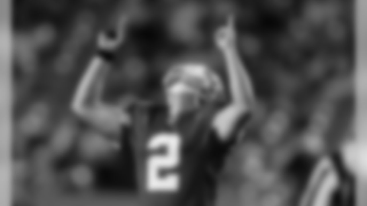 Kansas City Chiefs punter Dustin Colquitt (2) celebrates a big play during a 2005 away game.