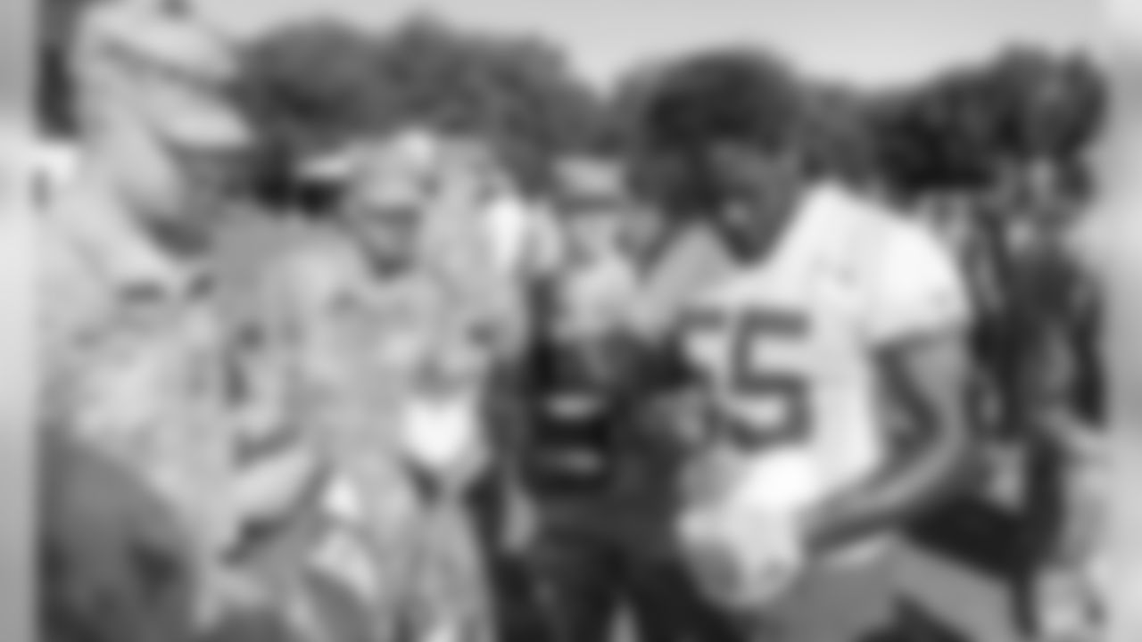 Kansas City Chiefs Defensive End Frank Clark (55) signs autographs for fans after a 2019 Training Camp practice at Missouri Western State University in St. Joseph, MO.