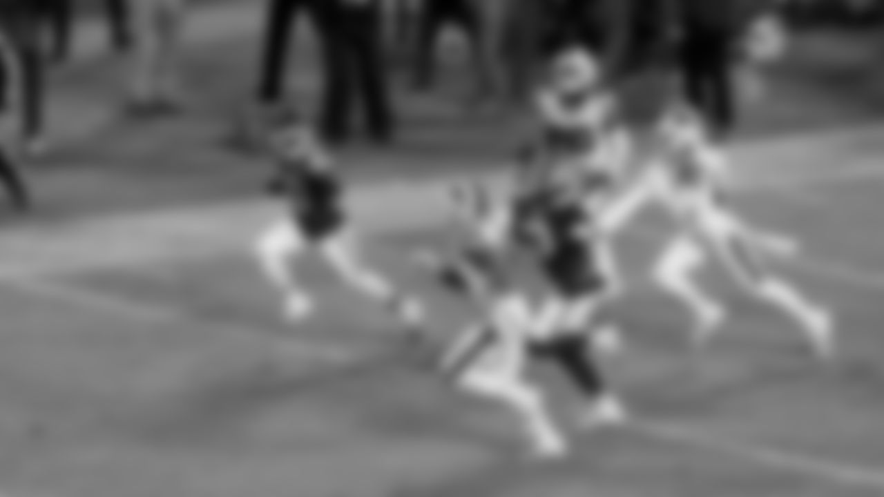 Kansas City Chiefs wide receiver Tyreek Hill (10) holds up a peace sign as he runs with the ball during the divisional playoff football game against the Buffalo Bills, Sunday, January 23, 2022 in Kansas City.