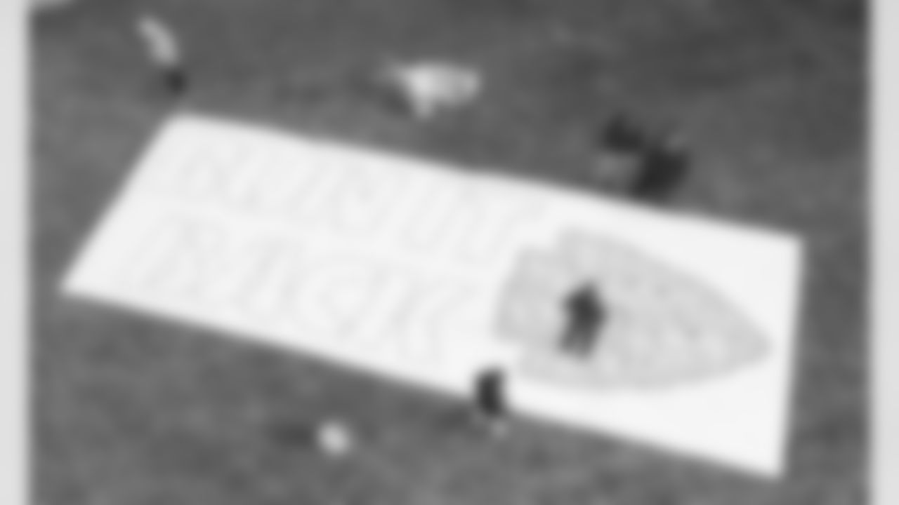 An aerial view of the Chiefs grounds crew preparing to paint a Run It Back logo on the Jackson County Courthouse lawn in Kansas City, MO