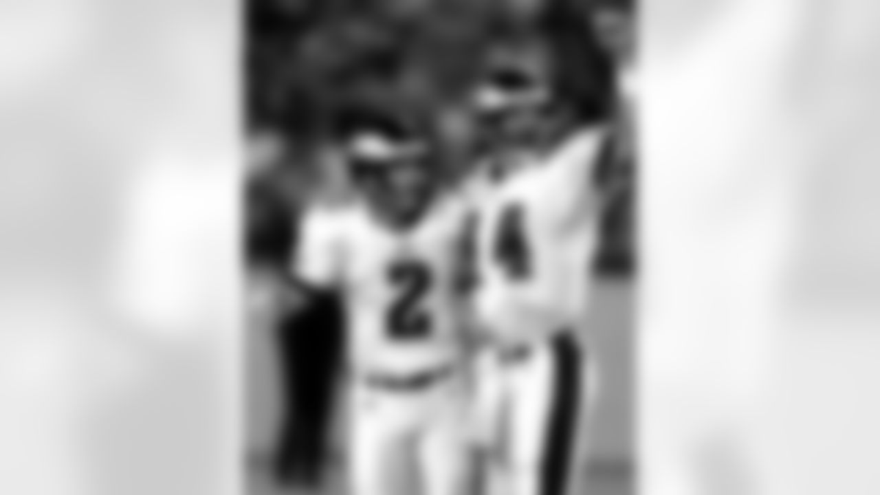Philadelphia Eagles holder Doug Pederson (14) and kicker David Akers watch as Akers' 56-yard field goal sails between the goal posts at the end of the second quarter of an NFL preseason game against the Baltimore Ravens in Baltimore, Aug. 5, 2000