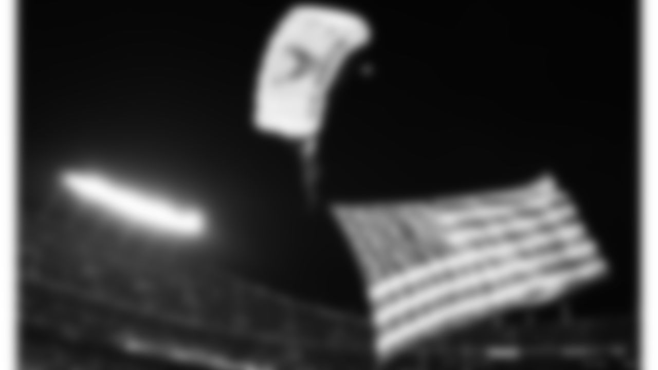 US Air Force Sky Jumpers parachute with the American Flag attached prior to an NFL football game against the New York Giants, Monday, November 1, 2021 in Kansas City.