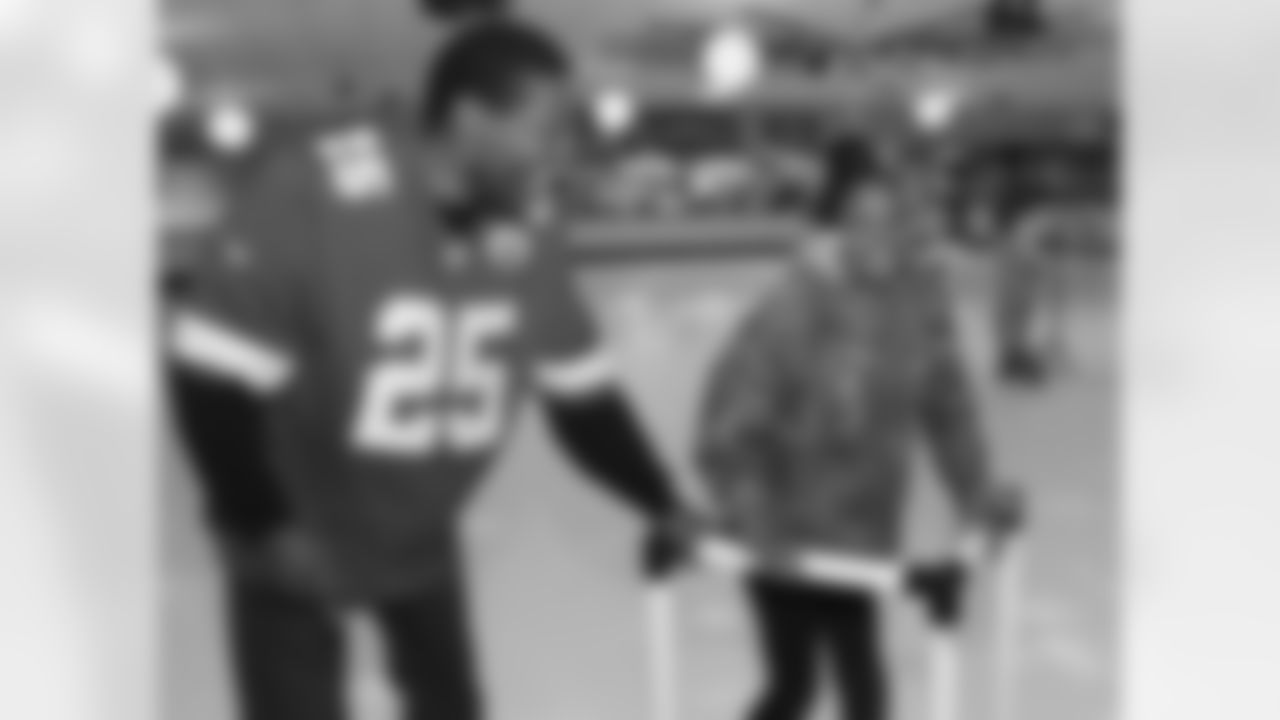 Chiefs Ambassador Mark Collins skates with youth from Operation Breakthrough.