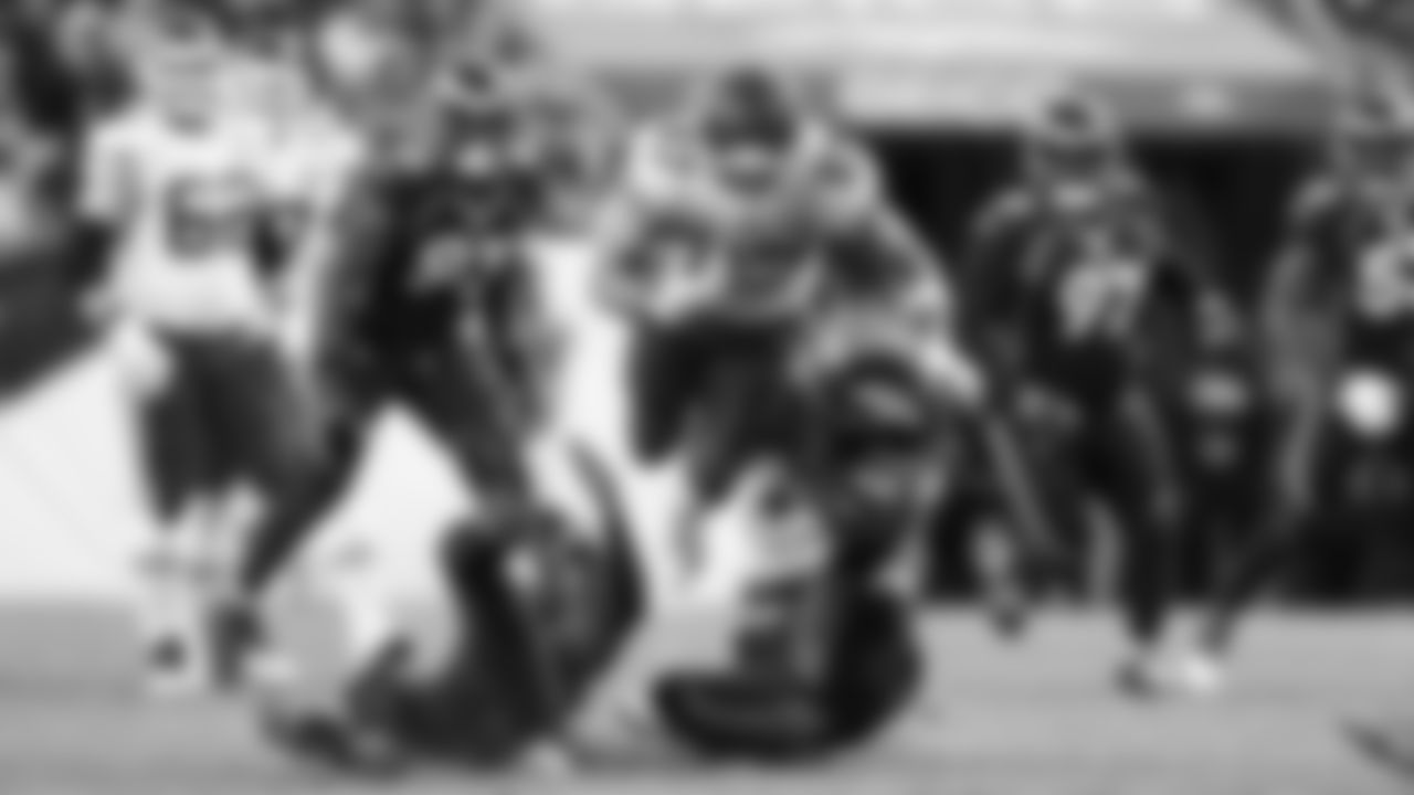 Kansas City Chiefs tight end Travis Kelce (87) dives over defenders during an NFL football game against the Denver Broncos, Sunday December 11, 2022