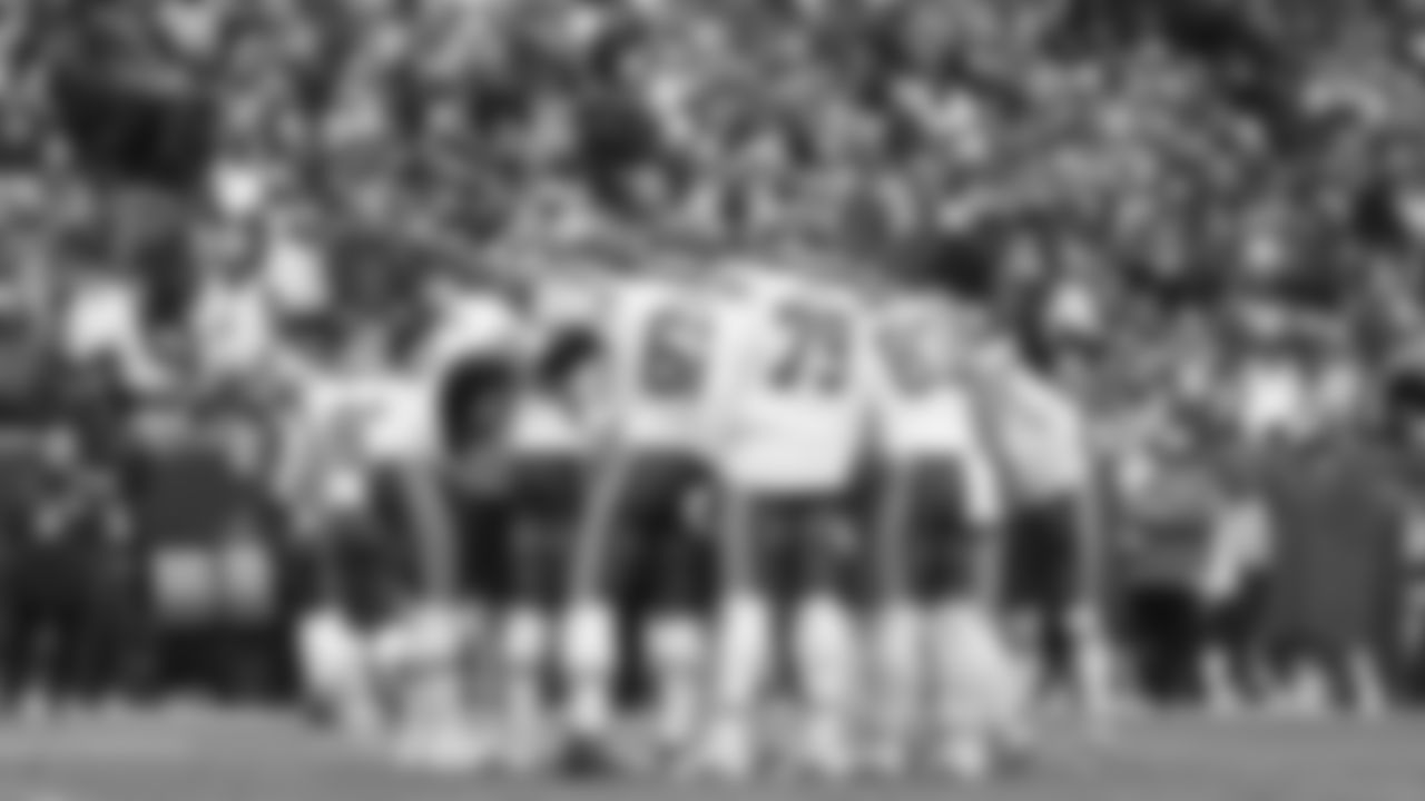 Kansas City Chiefs offense huddles during the NFL Week 8 matchup against the Denver Broncos at Empower Field at Mile High in Denver, Colorado on October 29, 2023.