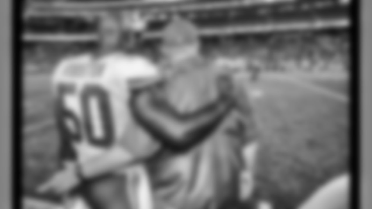 Kansas City Chiefs outside linebacker Justin Houston (50) embraces head coach Andy Reid during the final play of the game against the New England Patriots at Gillette Stadium on September 7 in Foxboro, Massachusetts.
