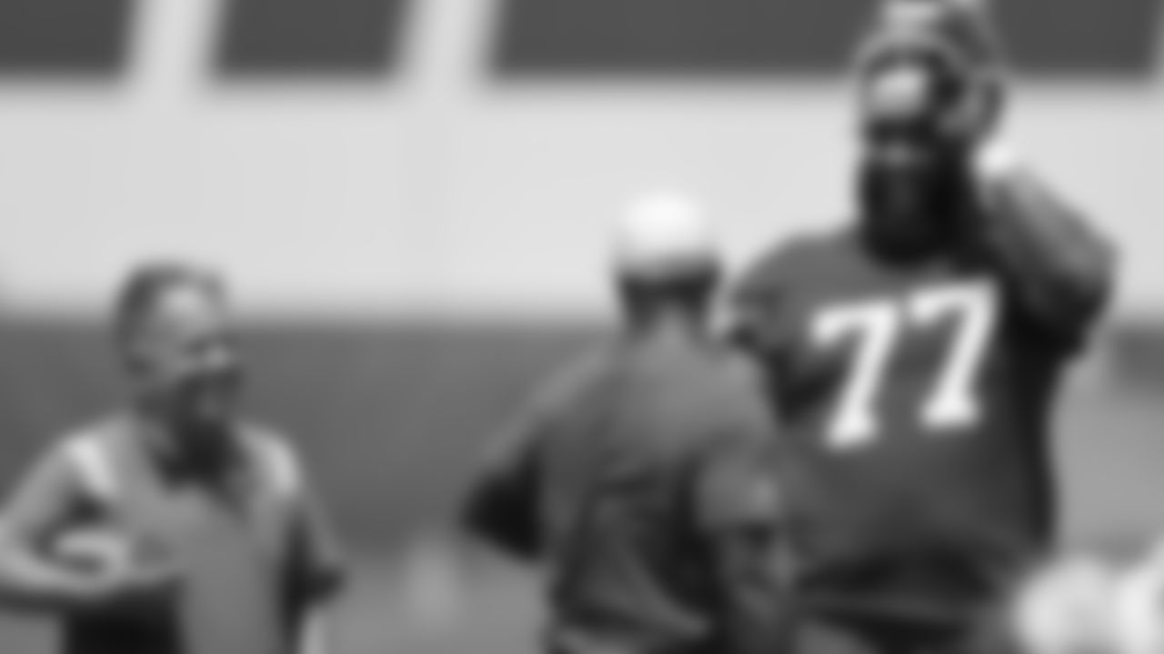 Kansas City Chiefs offensive lineman Lucas Niang (77) & assistant equipment manager Chris Shropshire at day 4 of OTAs on Tuesday, May 30, 2023 in Kansas City, MO.