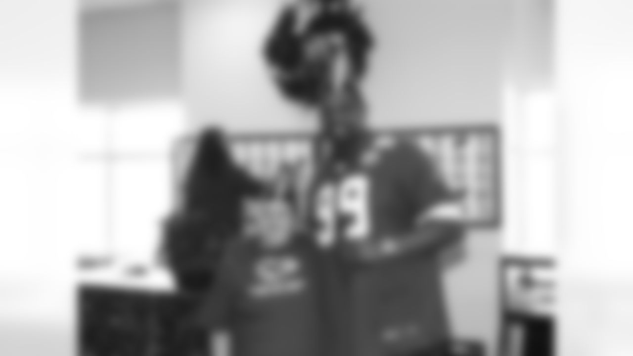 Kansas City Chiefs ambassadors and cheerleaders visit Bosco Senior Center on New Year Eve for a celebration