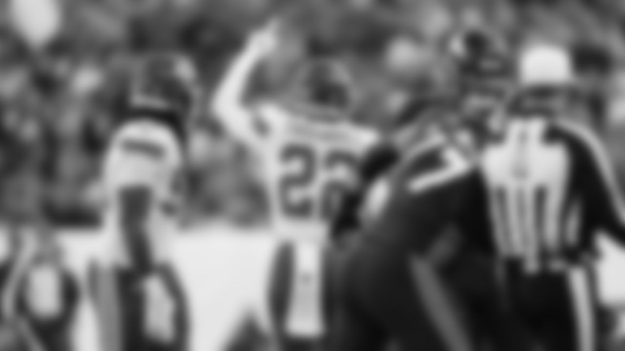 Kansas City Chiefs defensive back Juan Thornhill (22) celebrates sacking Broncos quarterback Russell Wilson (3) during an NFL football game against the Denver Broncos, Sunday, December 11, 2022 in Denver.