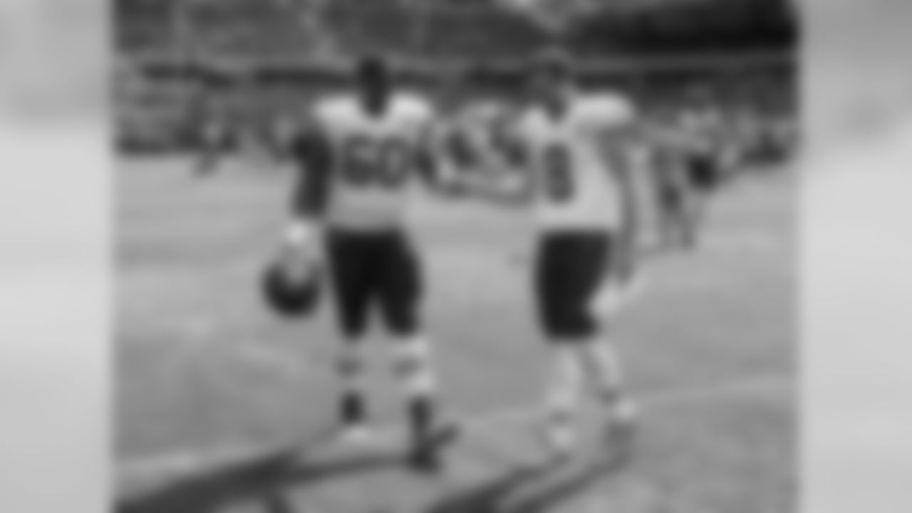 Kansas City Chiefs quarterback Kevin Hogan (8) fist bumps offensive lineman Jarrod Pughsley (60) after the preseason game against the Chicago Bears, Saturday, August 27, 2016, in Chicago, Illinois. The Chiefs beat the Bears 23-7.