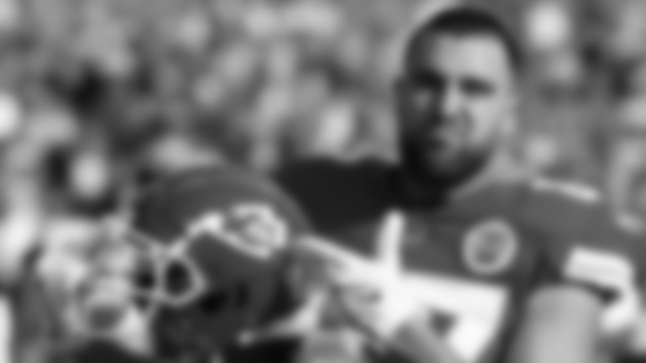 Kansas City Chiefs tight end Travis Kelce (87) pointing to the logo on his helmet prior to an NFL football game against the Denver Broncos, Sunday January 1, 2023 in Kansas City.