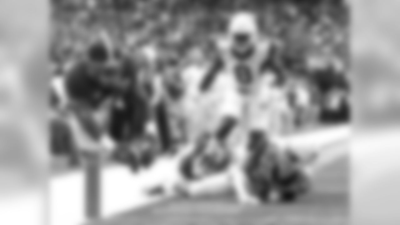 Alabama running back T.J. Yeldon (4) dives into the end zone for a touchdown as West Virginia's Travis Bell (26) and Karl Joseph (8) defend in the first half of an NCAA college football game Saturday, Aug. 30, 2014, in Atlanta.