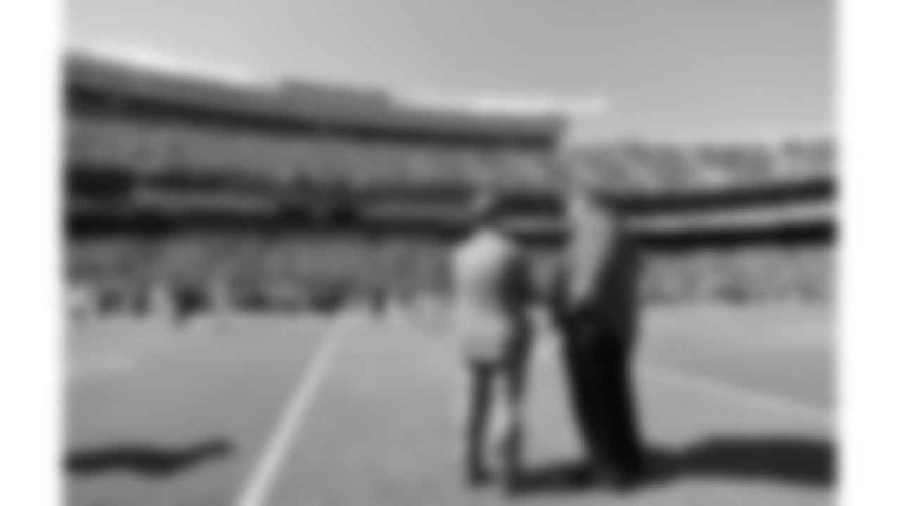 Kansas City Chiefs Chairman, CEO, and Owner Clark Hunt talks to Kansas City Chiefs Head Coach Andy Reid on the field before an NFL football game against the Los Angeles Chargers, Sunday, September 26, 2021 in Kansas City.